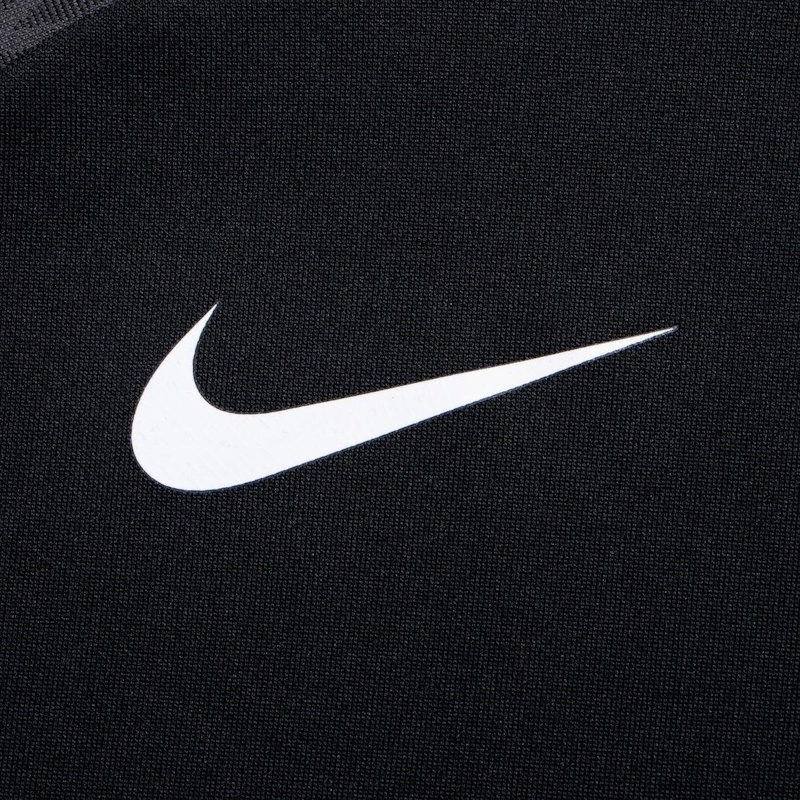 Close-up comparison of Nike clothing Swoosh logos