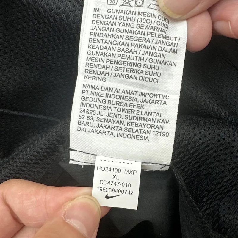 Nike clothing graphic placement and garment fit comparison